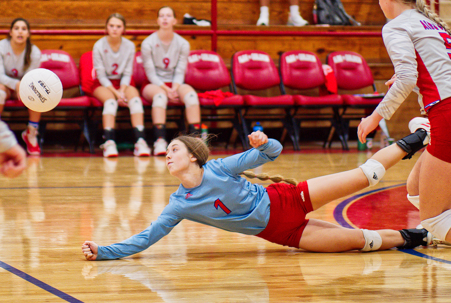 Kamrin Wright dives to save the ball for Alba-Golden in last week’s win over Winona.  [view more volleyball shots]